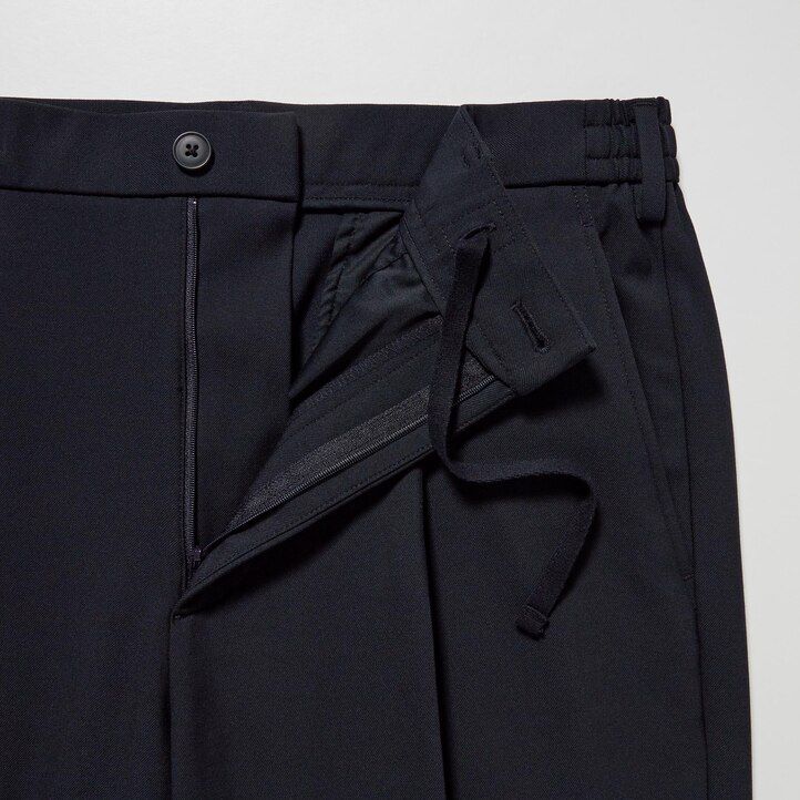 pánské kalhoty uniqlo two way stretch s plisovaným zúženým střihem béžové barvy