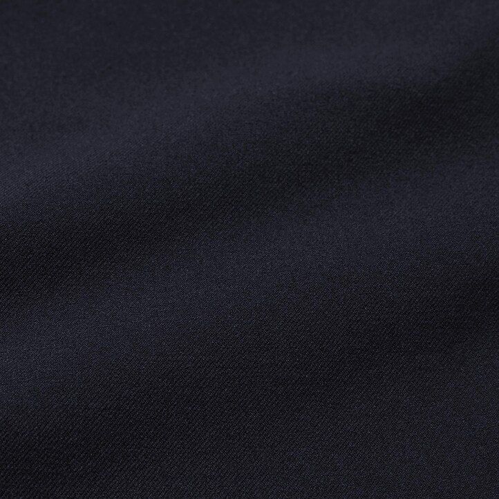 pánské kalhoty uniqlo two way stretch s plisovaným zúženým střihem béžové barvy