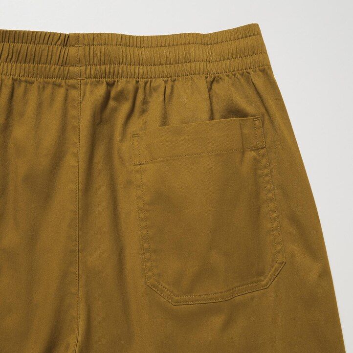 tmavě šedé pánské kalhoty uniqlo dry stretch easys